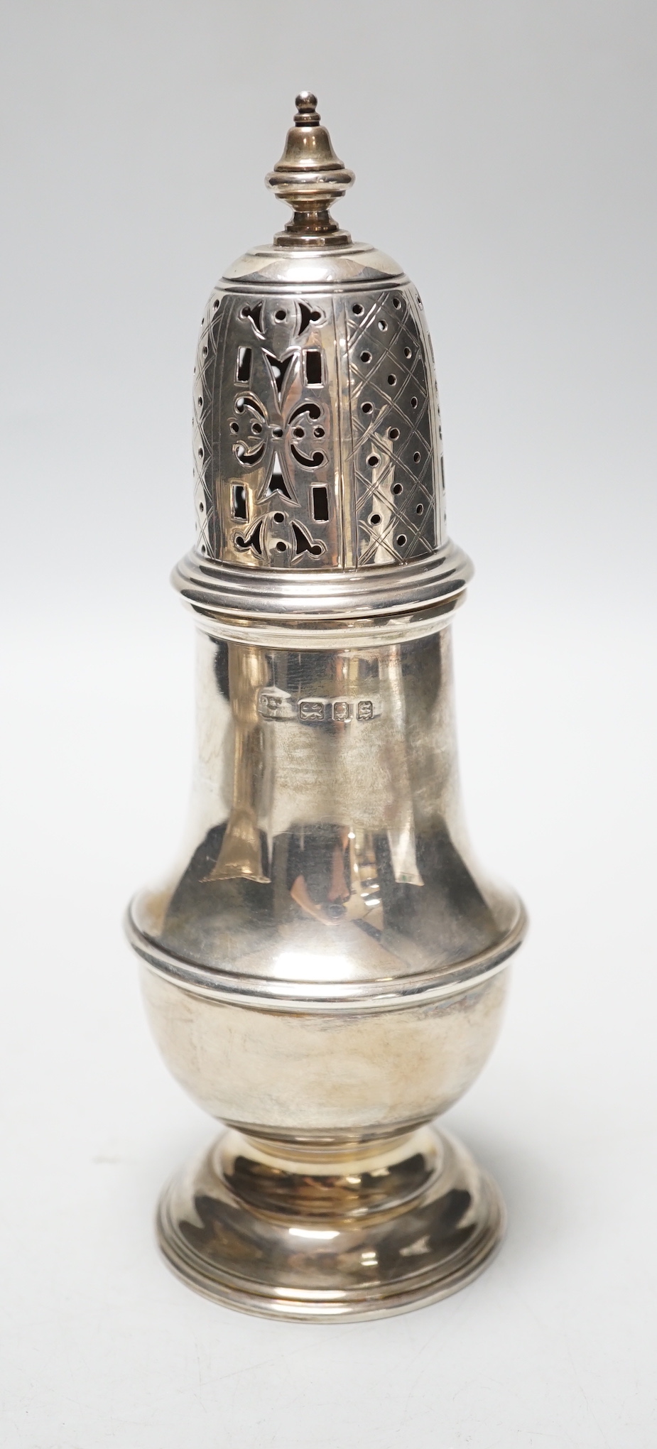 A George V silver baluster sugar caster, London, 1933, 18.9cm, 6.6oz.